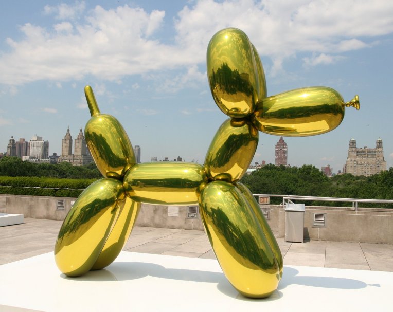 Jeff-Koons-Yellow-Dog-on-the-roof-of-Metropolitan-Museum-of-Art-in-New-York-City-in-October-2008.jpg